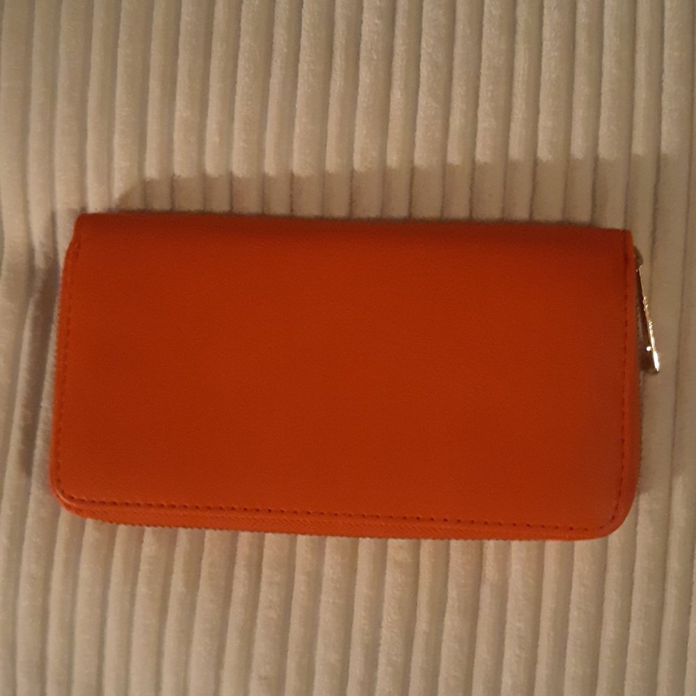 medium size Orange zip up wallet  by an off brand